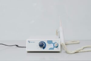 A high-tech ozone therapy device with a minimalistic design on a white backgroun